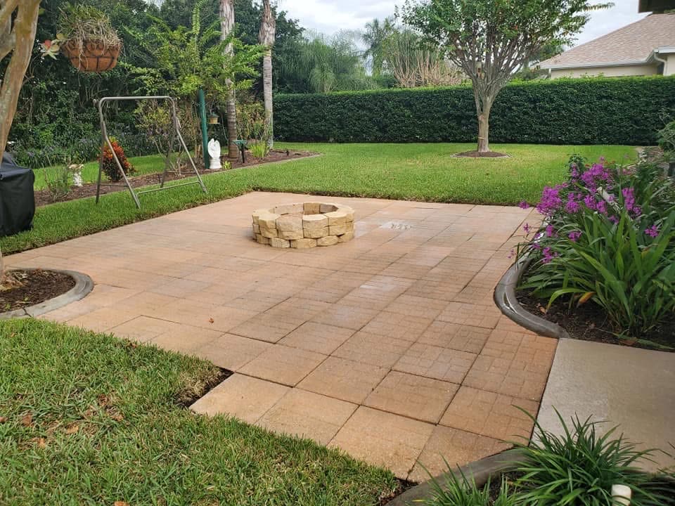 After: The same paver patio, clean and evenly colored